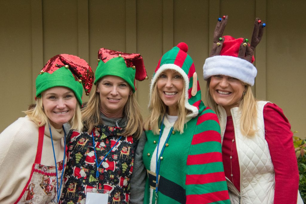 several women in christmas attire